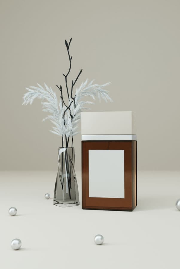 Diffuser reeds beside a framed picture